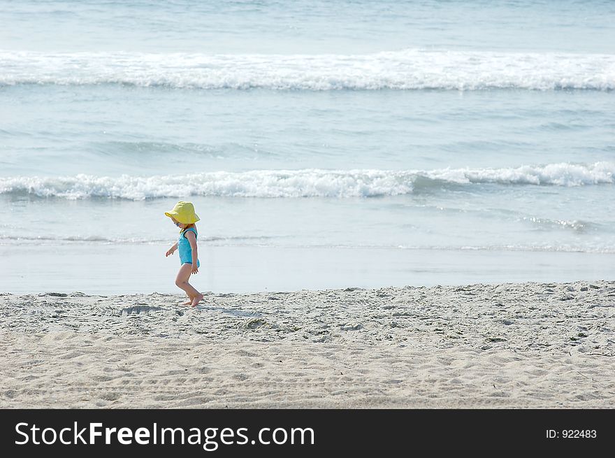 Young child playing in the sand. Young child playing in the sand.