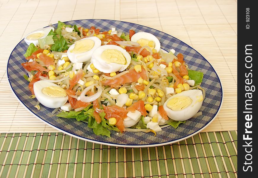 Healthy salad on a plate whit smoked salmon.