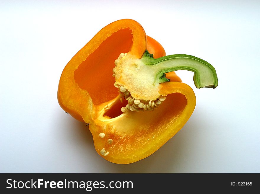 The yellow sweet pepper cut half-and-half. The yellow sweet pepper cut half-and-half