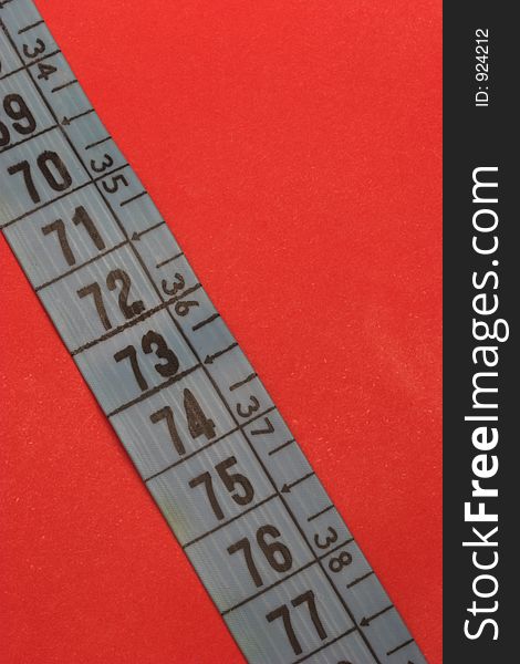 Measure tape with vivd red background