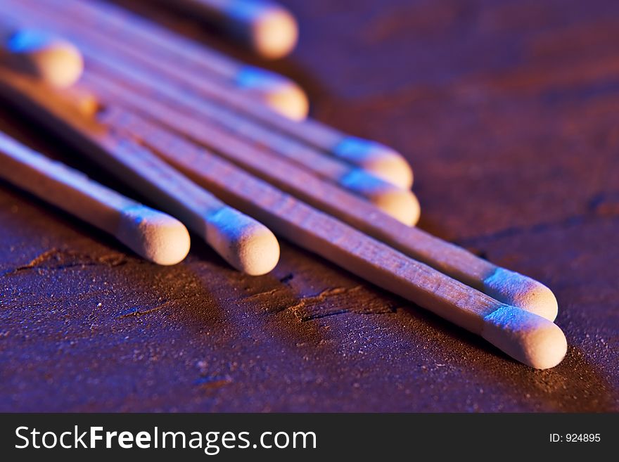 Matches laid out on an old piece of wood. Matches laid out on an old piece of wood