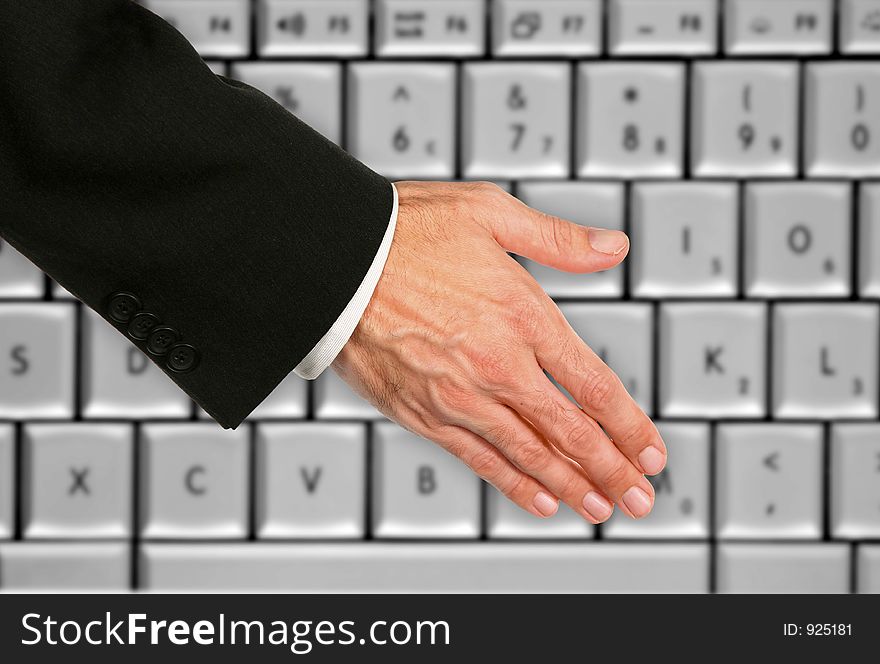 Hand Shake With Keyboard Background. Hand Shake With Keyboard Background