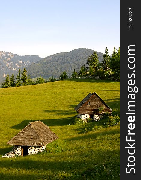 Two mountain shelters portrait. Two mountain shelters portrait