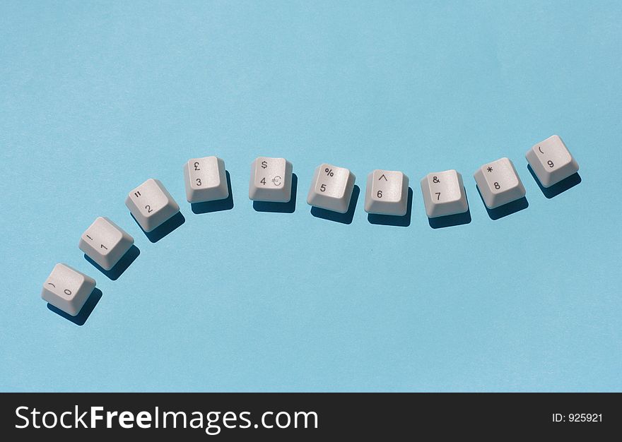 Number keys from a computer keyboard arranged in a snaking line. Number keys from a computer keyboard arranged in a snaking line