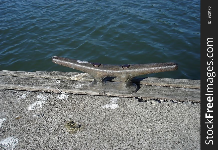 Boat Mooring On Wooden Rail