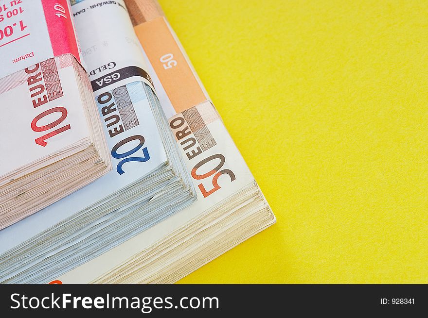 Different money batches on yellow background. Different money batches on yellow background