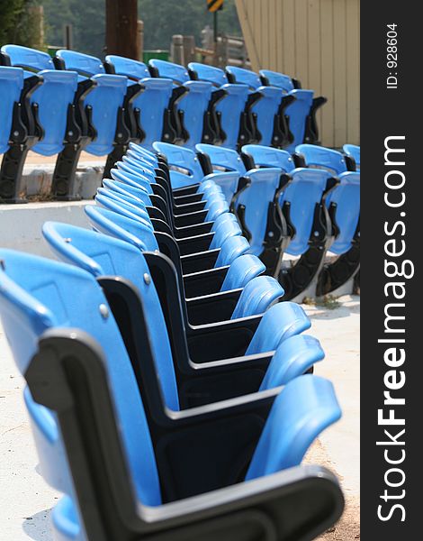 Rows of blue stadium chairs. Rows of blue stadium chairs