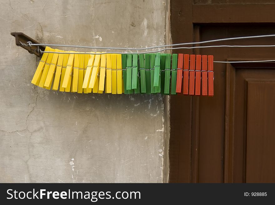 Color cordinated pegs on a washing line