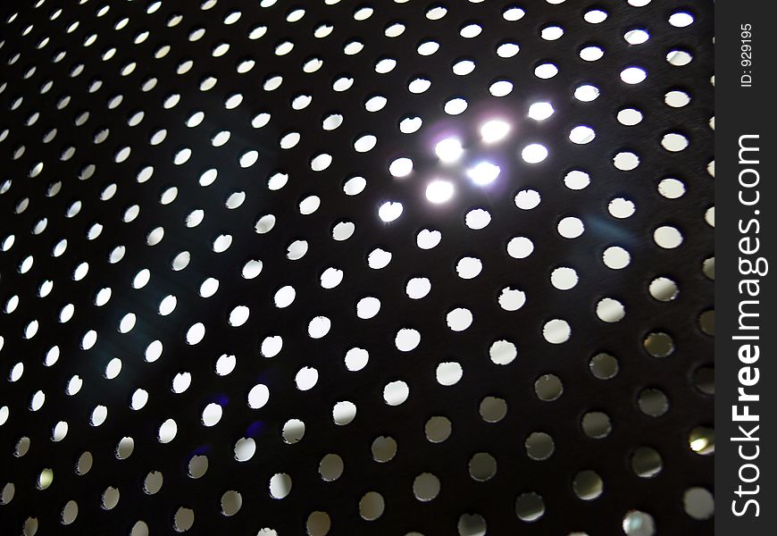 Sunlight through punched steel. Sunlight through punched steel