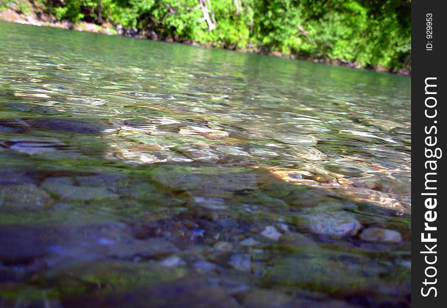 Surface of the water at a shallow spot in a slow-moving river. Surface of the water at a shallow spot in a slow-moving river