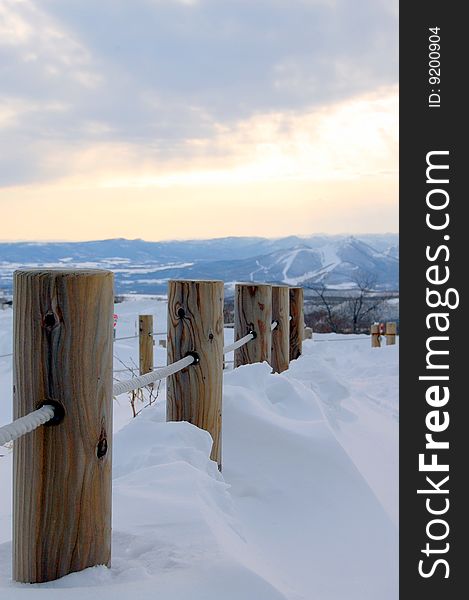 The wooden pillar buried in the snow in Hokkaido