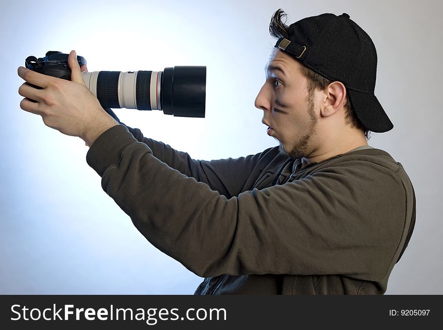 Young man with a photo camera in his hands