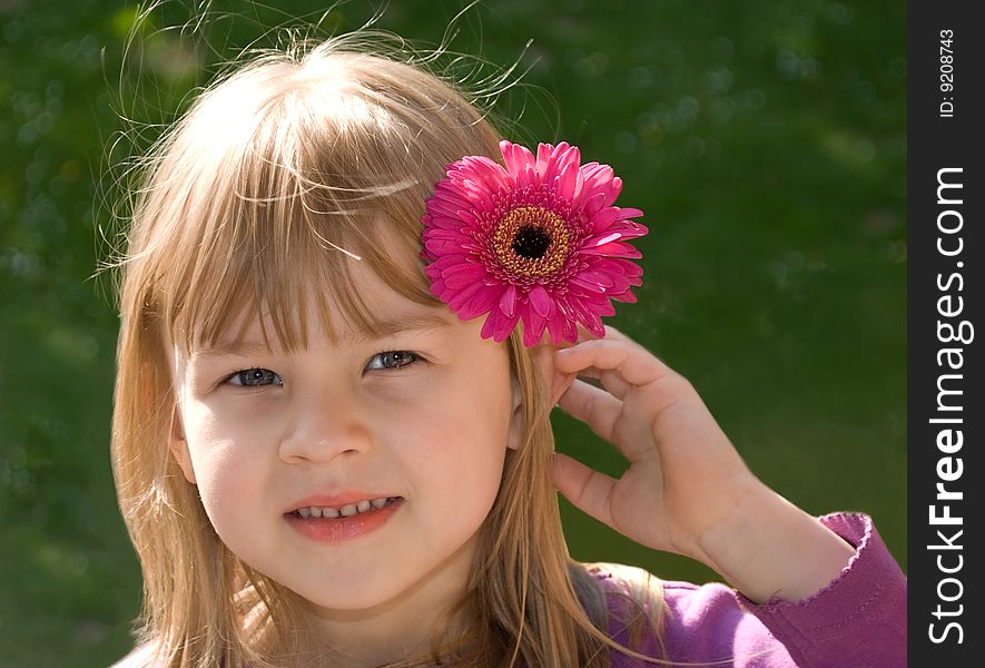 The beautiful girl with a flower in a head. The beautiful girl with a flower in a head.