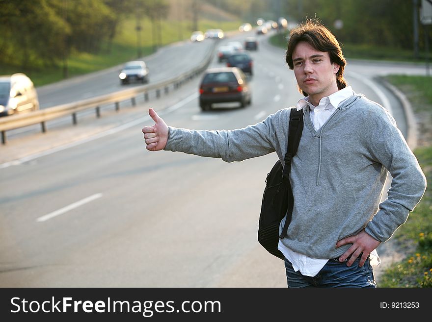 Student hitchhiking - need a drive. Student hitchhiking - need a drive