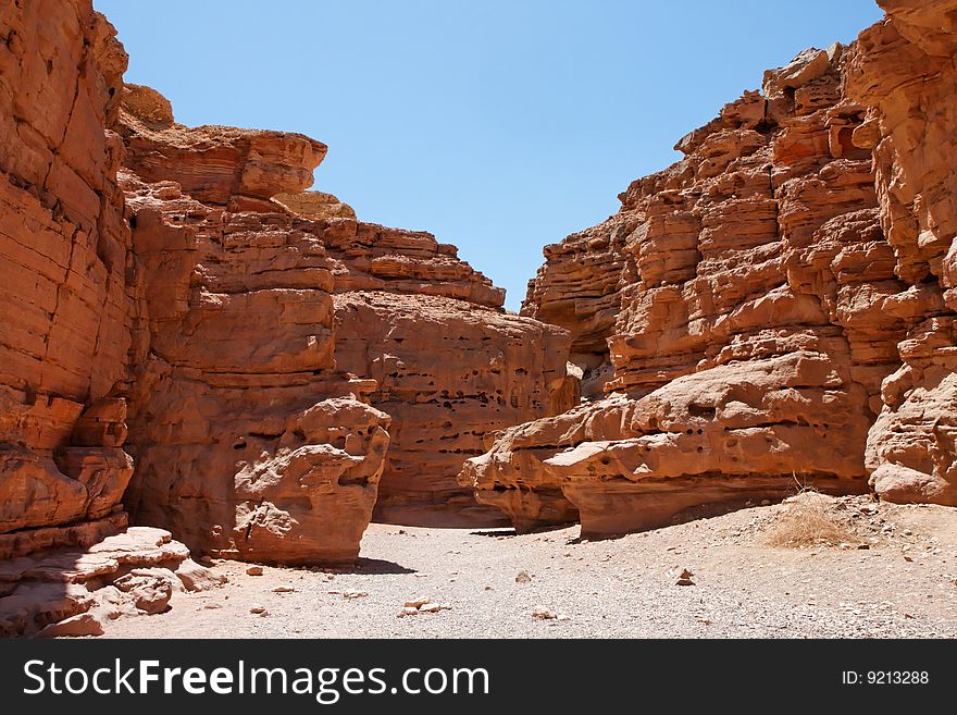 Desert landscape of weathered red rocks in Red Canyon, Israel