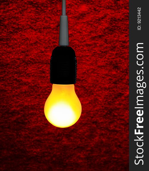 Yellow lamp with wire. lightbulb on red background. Yellow lamp with wire. lightbulb on red background