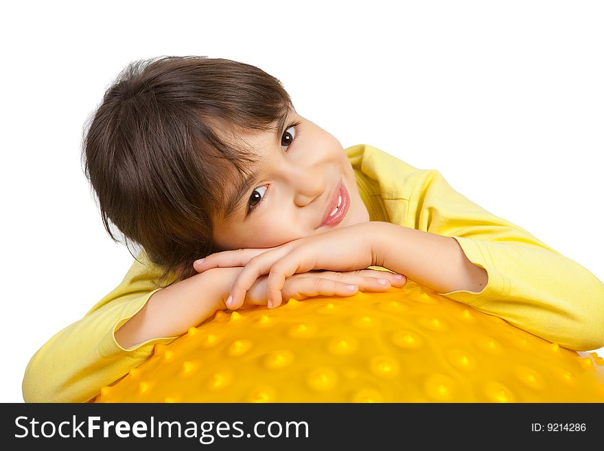 Laughing young girl on the yellow ball. Laughing young girl on the yellow ball