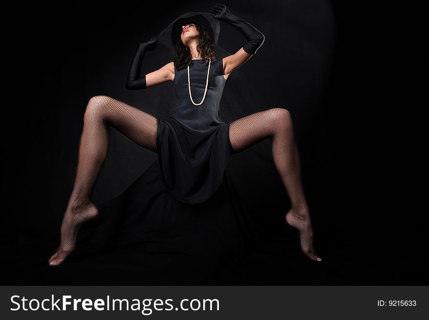 Girl with in hat with veil against black background. Girl with in hat with veil against black background