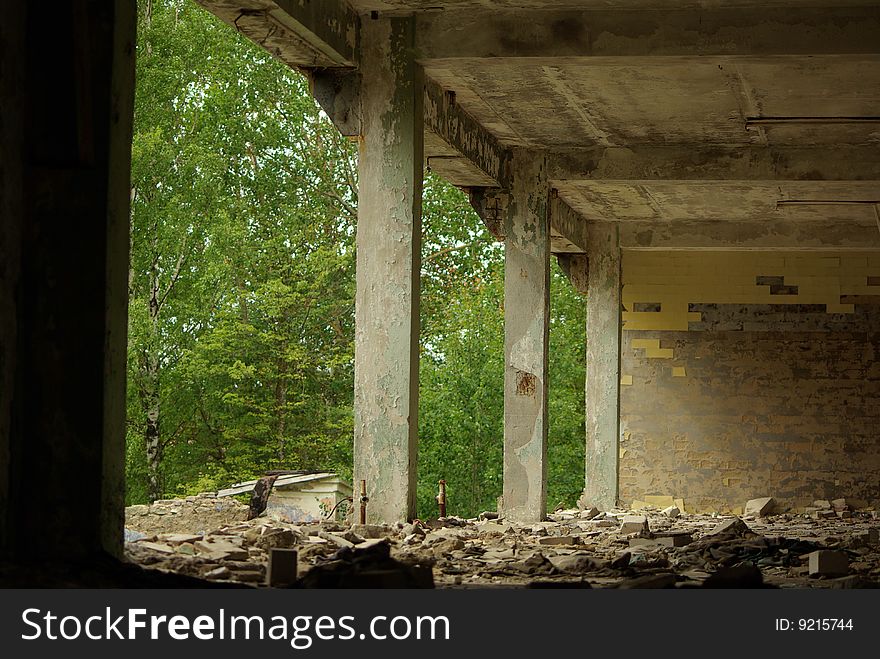 Apartment building in ruins near forest