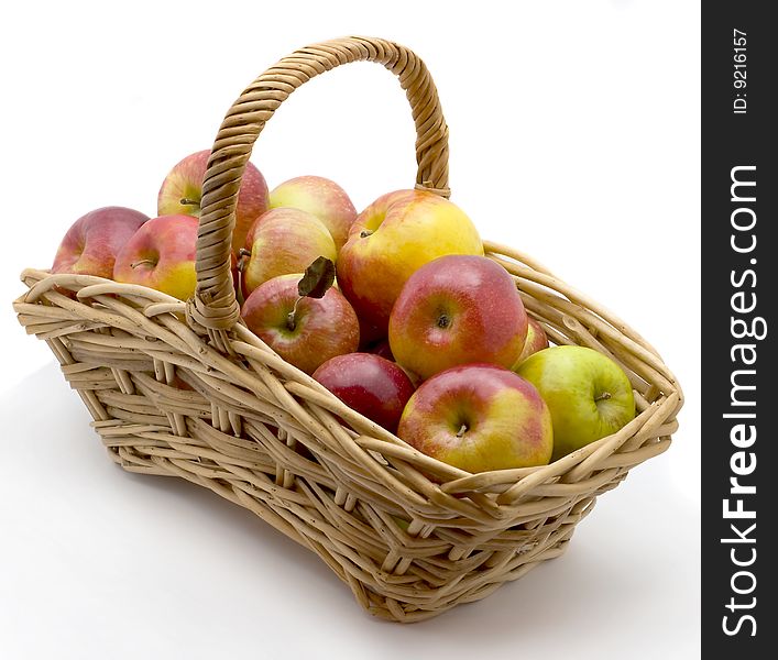 Basket with  apples  isolated on a white background