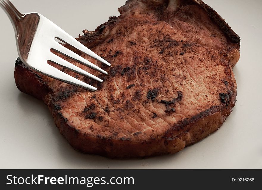 Piece Of Meat On A Plate