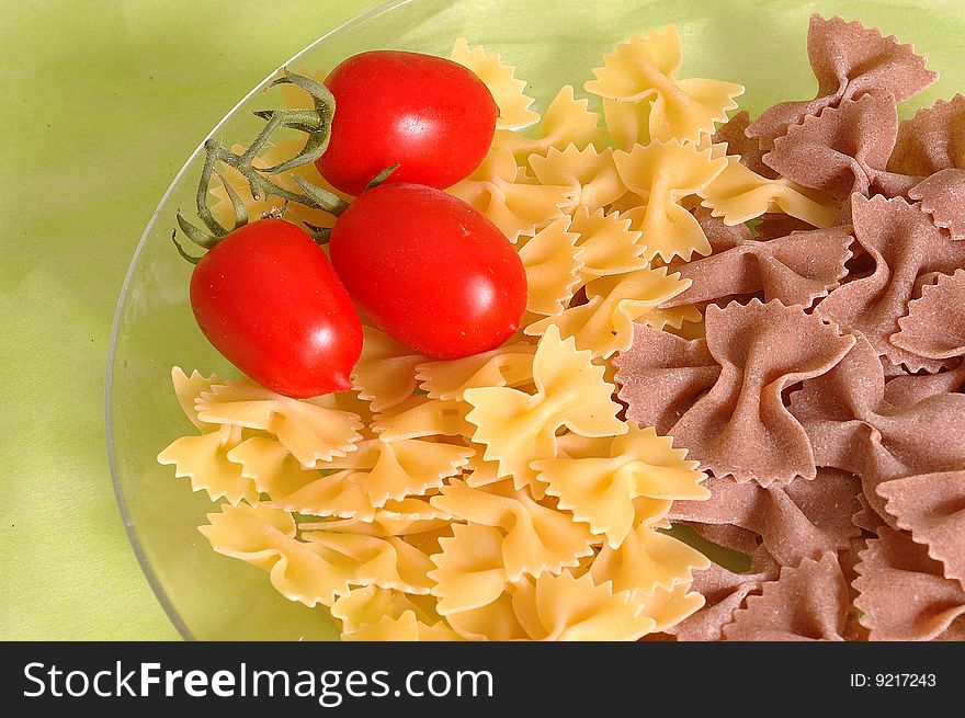 Butterfly raw  pasta and tomato