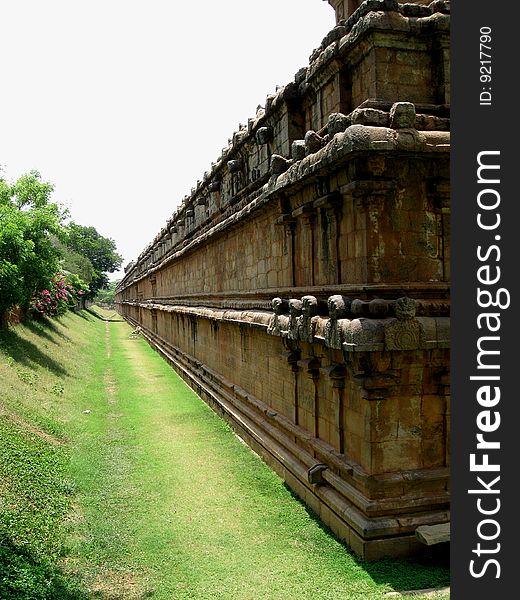 This is a large temple wall that is built of stones during the Chola period of ruling in Tanjavore of Tamil Nadu, India. This is a large temple wall that is built of stones during the Chola period of ruling in Tanjavore of Tamil Nadu, India.
