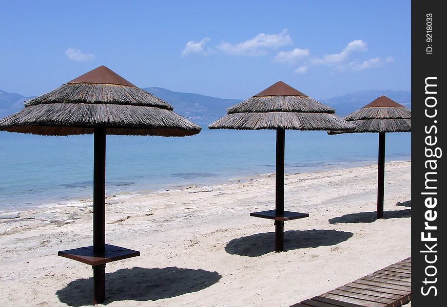 Parasols on a Greek beach. Parasols on a Greek beach