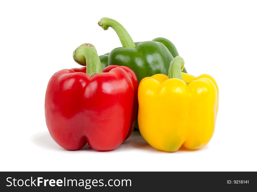 Green, yellow and red paprika, isolated on white background with shadow