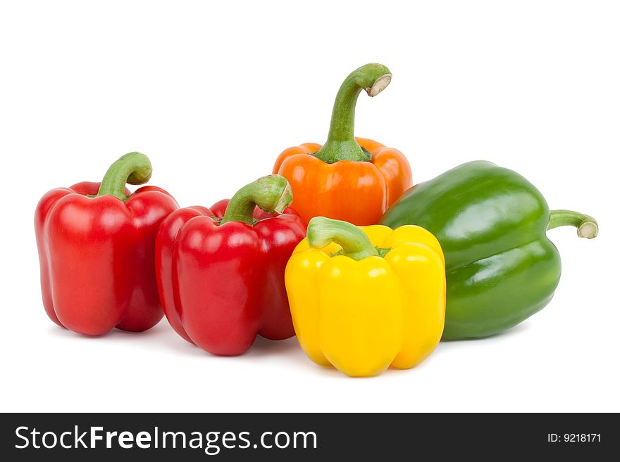 Green, yellow, orange and red paprika, isolated on white background with shadow