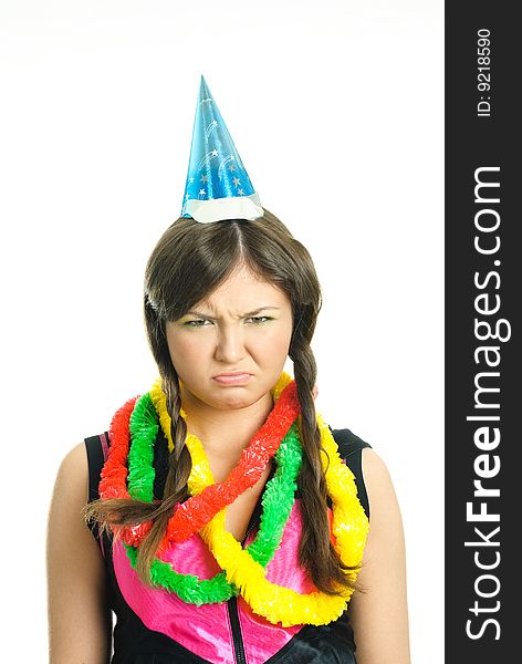 Portrait of an unhappy brunette teenage girl celebrating her birthday. Portrait of an unhappy brunette teenage girl celebrating her birthday