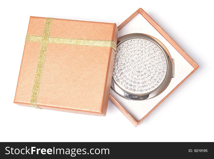 Gift box and hand mirror, isolated on white background