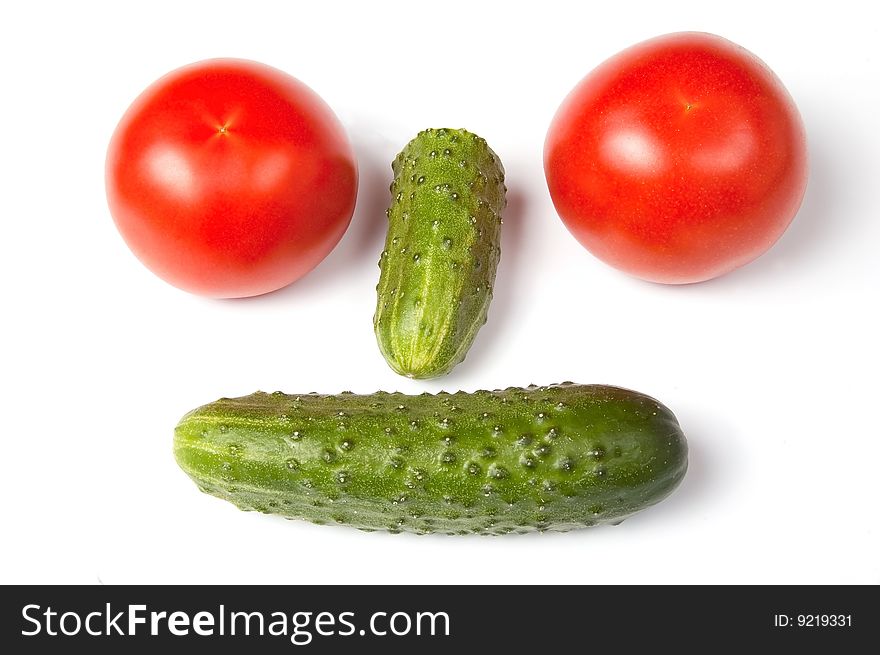 Cucumbers and tomatoes in funny vagetable face, isolated on white background. Cucumbers and tomatoes in funny vagetable face, isolated on white background