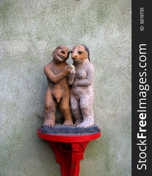 Two sculpture of laughing figurines at the old wall in Cesky Krumlov. Two sculpture of laughing figurines at the old wall in Cesky Krumlov