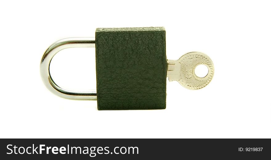 Padlock and inserted key over white