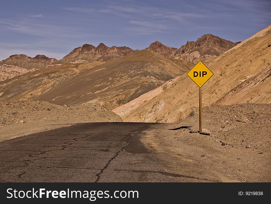 This is a picture of a Dip sign on the road through Artist Palette at Death Valley National Park in California. This is a picture of a Dip sign on the road through Artist Palette at Death Valley National Park in California.