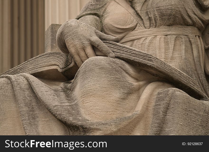 Open Book On The Lap Of Robert Ingersoll Aitken&#x27;s &#x22;Future,&#x22; On The North Side Of The National Archives &#x28;Washington, DC&#x29;