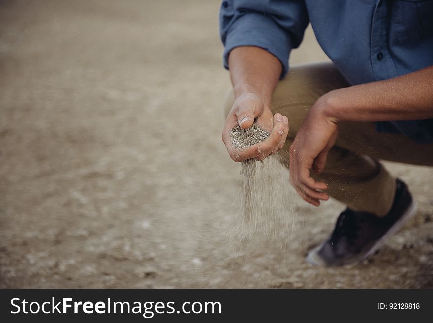 Person Examining Soil