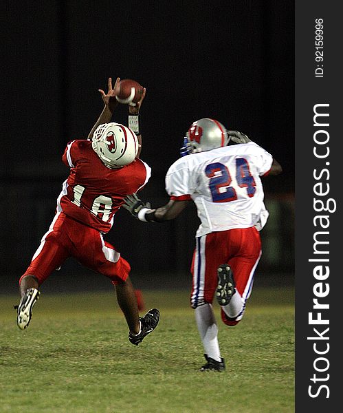 2 Football Player Running After the Ball in Shallow Focus Photography