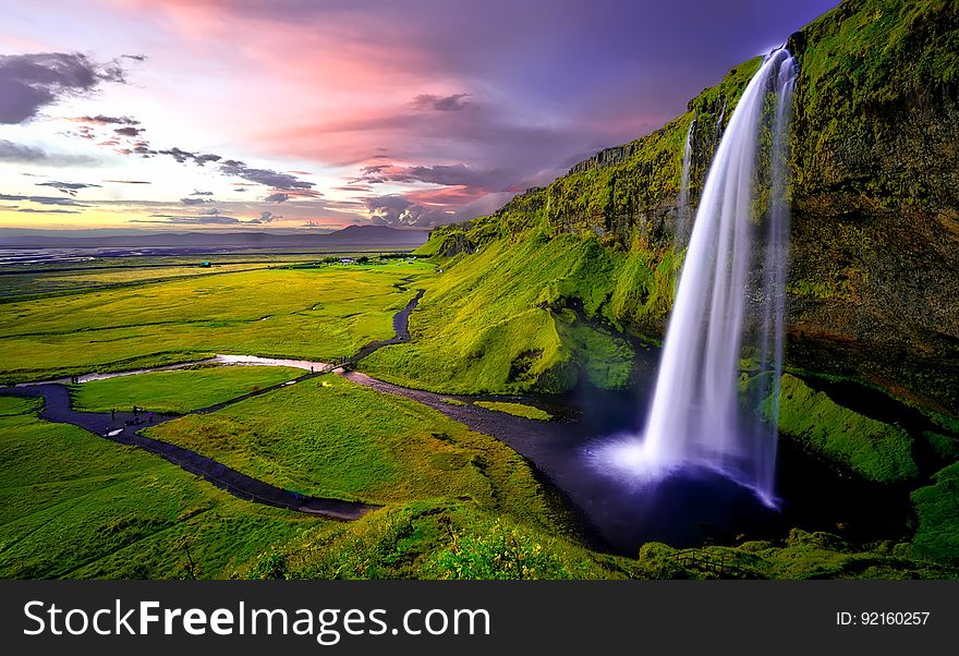 Time Lapse Photography Of Waterfalls During Sunset