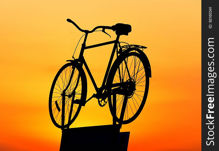 Silhouette of Cruiser Bike during Sunset