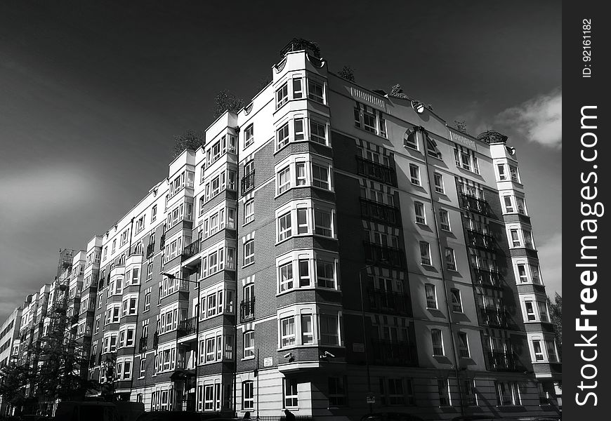 Angular corner of apartment block exterior in black and white. Angular corner of apartment block exterior in black and white.