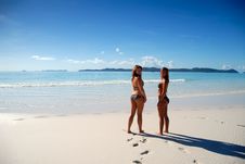 Two Young Girls Standing By Paradise Ocean Stock Photography Two Young Girls Standing By Paradise Ocean Stock Photography