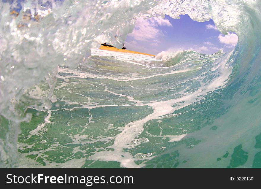 Photo of a curling wave at Sandy Beach on the island of Oahu, Hawaii. Photo of a curling wave at Sandy Beach on the island of Oahu, Hawaii.