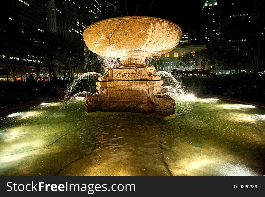 Illuminated fountain at night in New York City's Bryant Park. Illuminated fountain at night in New York City's Bryant Park.