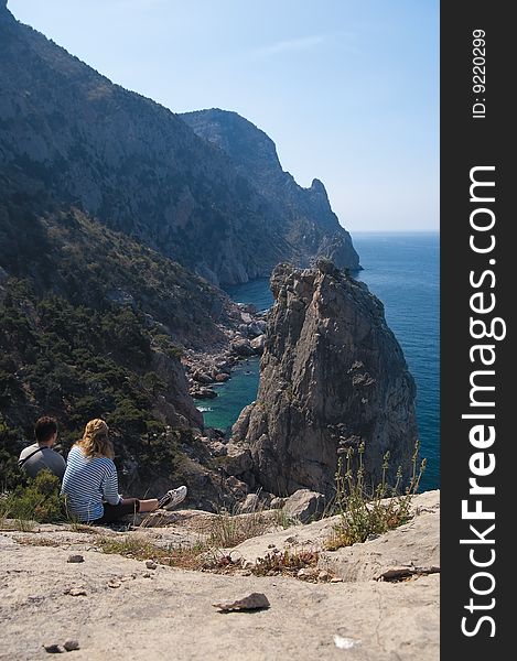 Unapproachable rock in the sea and tourists
Ukraine, Crimea, Reserve cape Ajja