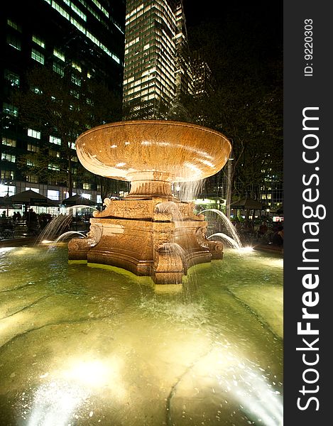 Illuminated fountain at night in New York City's Bryant Park. Illuminated fountain at night in New York City's Bryant Park.