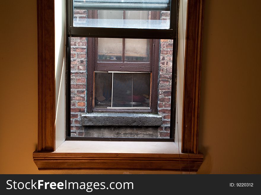 View from a window in a city apartment, of another window three feet away. View from a window in a city apartment, of another window three feet away.