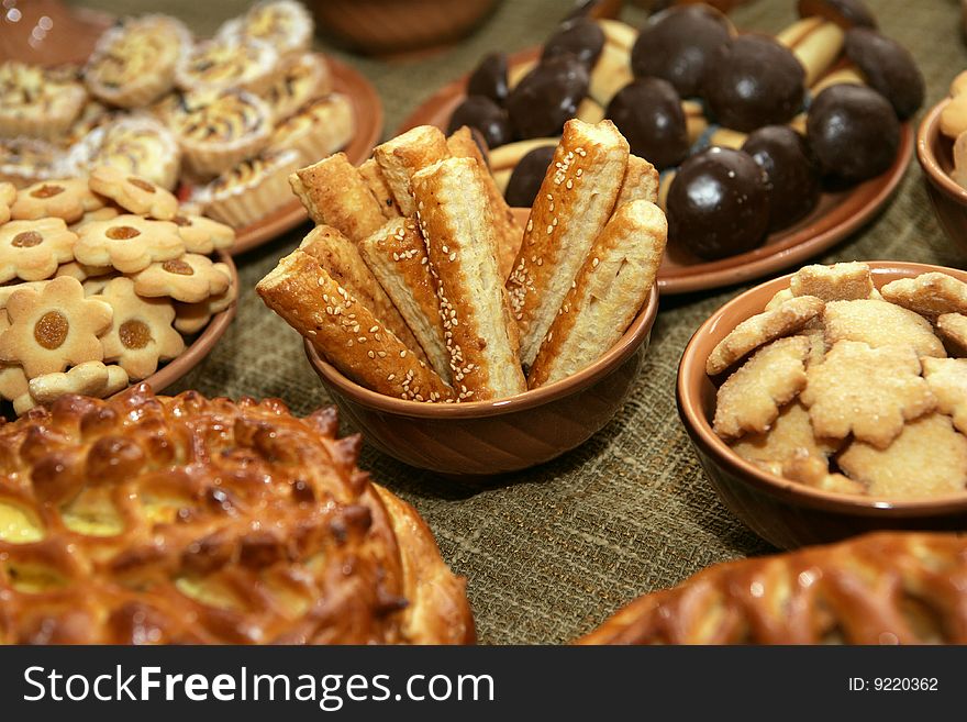 A lot of tasty cookies laying in plates. A lot of tasty cookies laying in plates