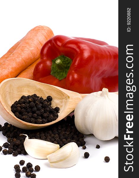 Carrots, red paprica, garlic and black pepper closeup. Carrots, red paprica, garlic and black pepper closeup
